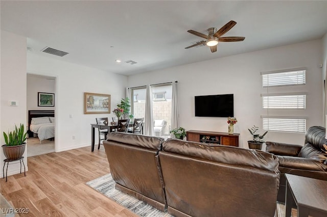 897 Woodburn Ln, Las Vegas, NV 89138 - living room featuring a ceiling fan and light wood-type flooring