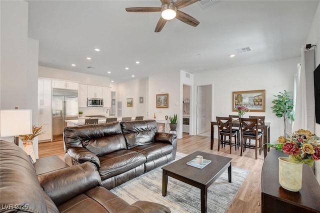 897 Woodburn Ln, Las Vegas, NV 89138 - living area featuring ceiling fan, light wood finished floors, and recessed lighting