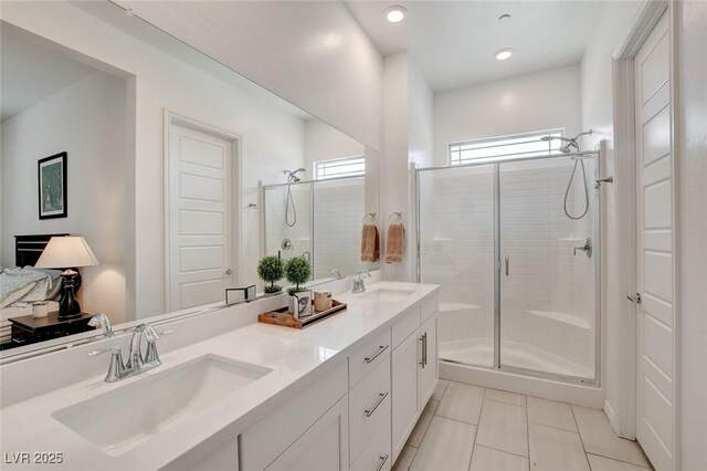 897 Woodburn Ln, Las Vegas, NV 89138 - bathroom with a shower stall, tile patterned flooring, double vanity, and recessed lighting