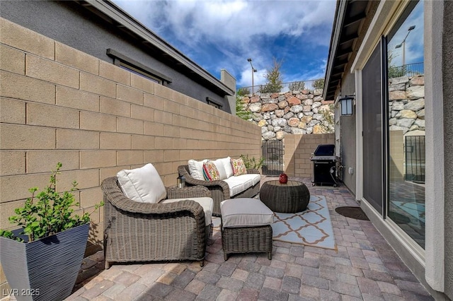 897 Woodburn Ln, Las Vegas, NV 89138 - view of patio / terrace featuring a grill, a gate, and outdoor lounge area