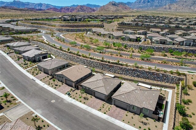 897 Woodburn Ln, Las Vegas, NV 89138 - aerial perspective of suburban area featuring a mountainous background