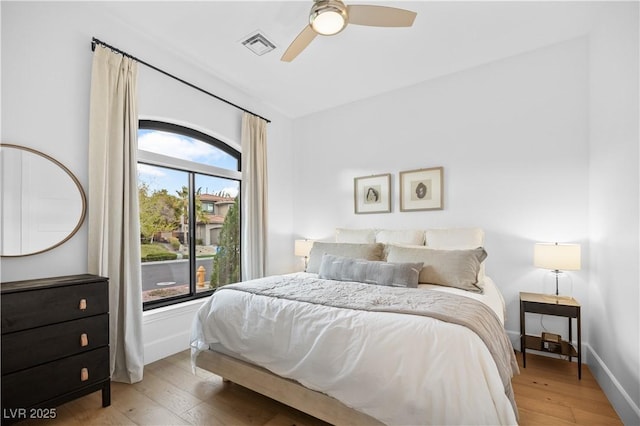 10969 Tranquil Waters Ct, Las Vegas, NV 89135 - bedroom with light wood-style floors, baseboards, and a ceiling fan
