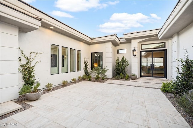 10969 Tranquil Waters Ct, Las Vegas, NV 89135 - entrance to property with stucco siding and a patio area