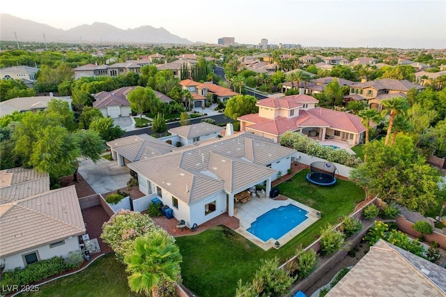 10969 Tranquil Waters Ct, Las Vegas, NV 89135 - aerial perspective of suburban area with a mountainous background and a pool area