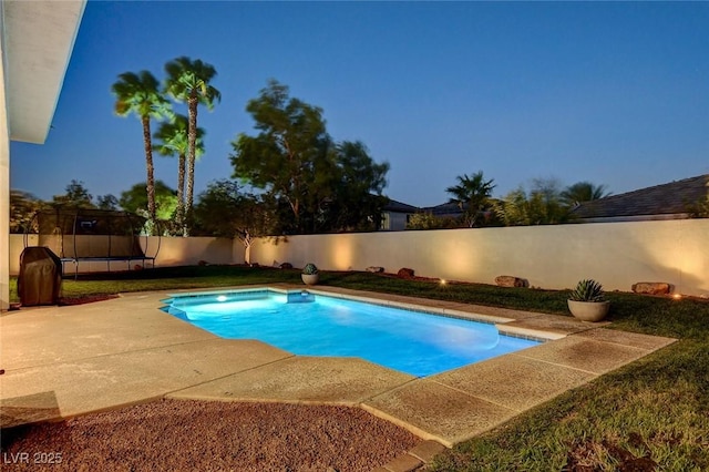10969 Tranquil Waters Ct, Las Vegas, NV 89135 - view of pool with a trampoline, a fenced backyard, and a patio area