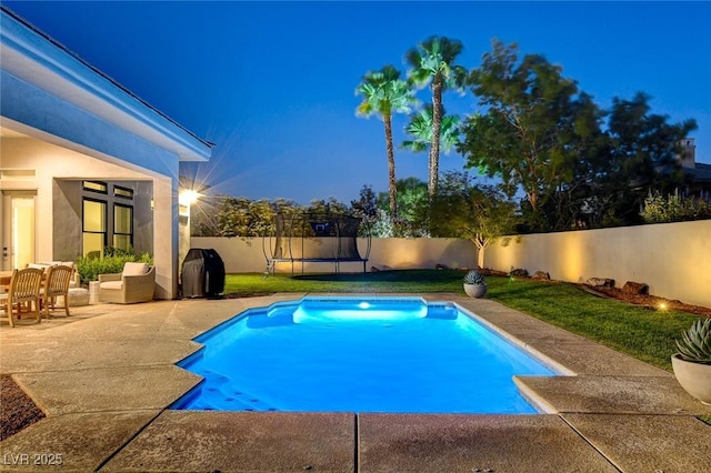 10969 Tranquil Waters Ct, Las Vegas, NV 89135 - view of pool with a trampoline, a fenced backyard, and a patio area