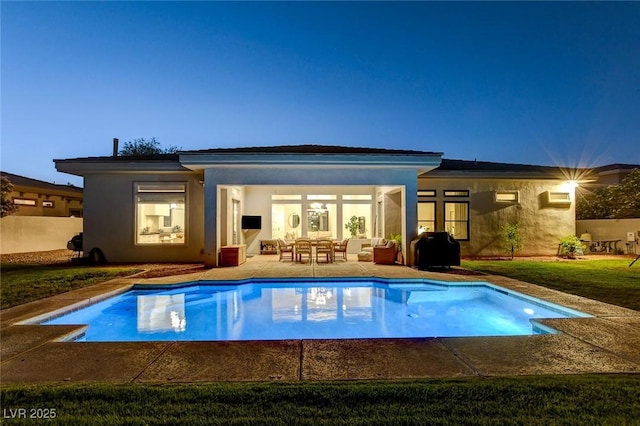 10969 Tranquil Waters Ct, Las Vegas, NV 89135 - rear view of house with an outdoor pool, stucco siding, and a patio