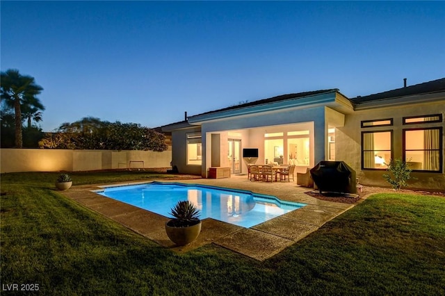 10969 Tranquil Waters Ct, Las Vegas, NV 89135 - back of property featuring a yard, a patio, and stucco siding