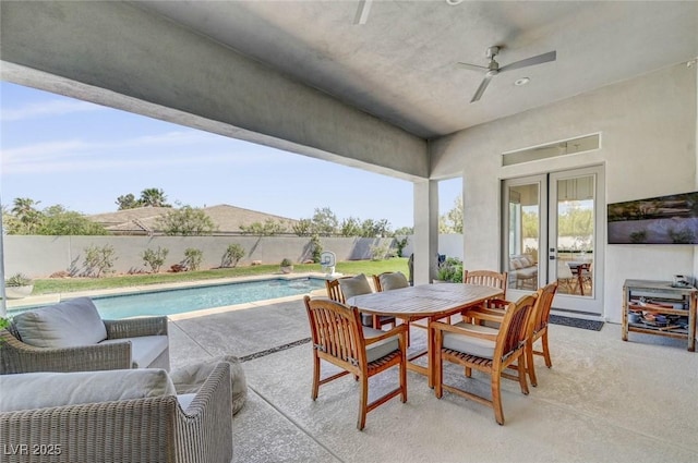 10969 Tranquil Waters Ct, Las Vegas, NV 89135 - view of patio featuring a fenced backyard, a ceiling fan, and outdoor dining area
