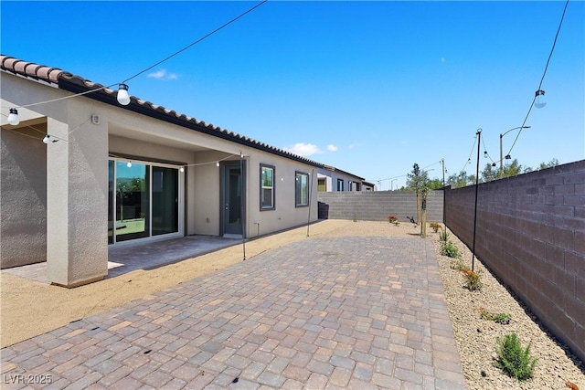 10158 Super Jovian St, Las Vegas, NV 89143 - fenced backyard featuring a patio