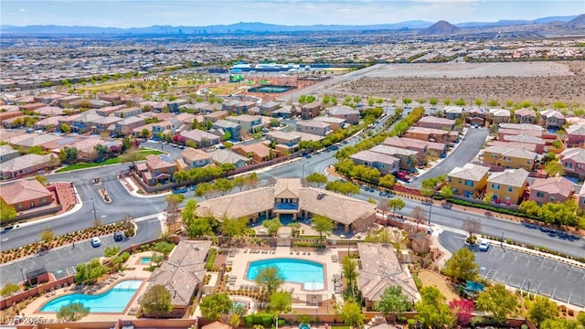 birds eye view of property featuring a mountain view and a residential view