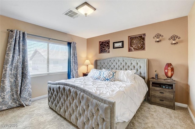 carpeted bedroom featuring baseboards
