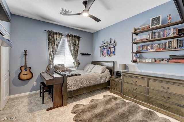 carpeted bedroom featuring ceiling fan and baseboards