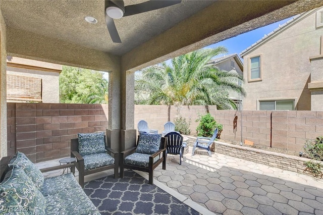 view of patio featuring a fenced backyard and ceiling fan
