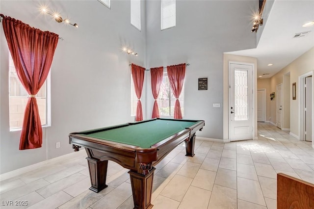 game room featuring billiards table, baseboards, a towering ceiling, and light tile patterned floors