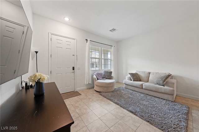 living room with baseboards, light tile patterned flooring, visible vents, and recessed lighting