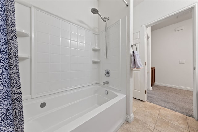 full bath featuring tile patterned floors, baseboards, and shower / tub combo with curtain