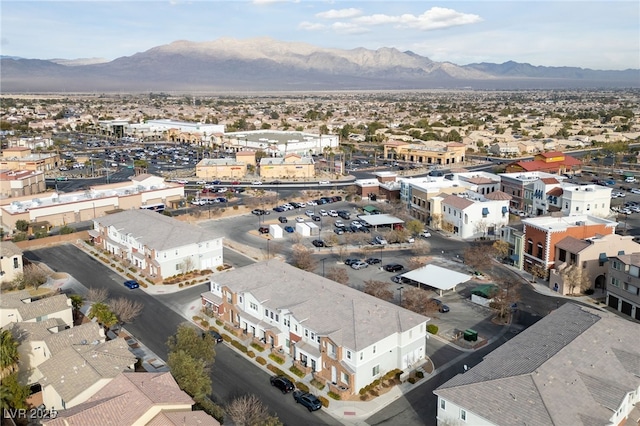 birds eye view of property featuring a mountain view