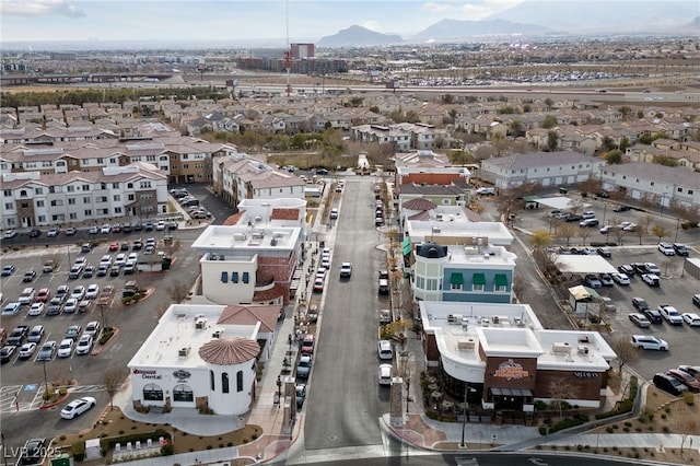 birds eye view of property featuring a mountain view