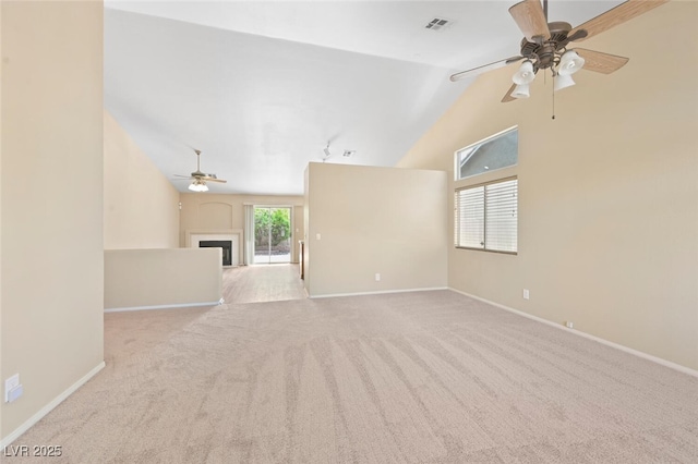 1805 Candle Bright Dr, Henderson, NV 89074 - unfurnished living room with baseboards, high vaulted ceiling, a ceiling fan, a fireplace, and carpet floors