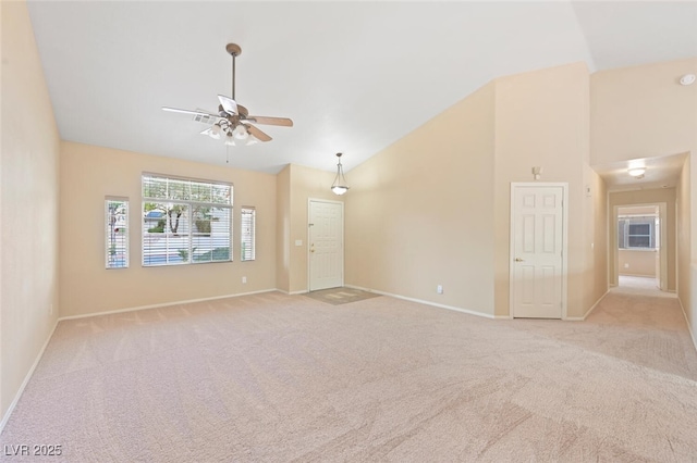 1805 Candle Bright Dr, Henderson, NV 89074 - unfurnished living room featuring light carpet, a ceiling fan, and baseboards