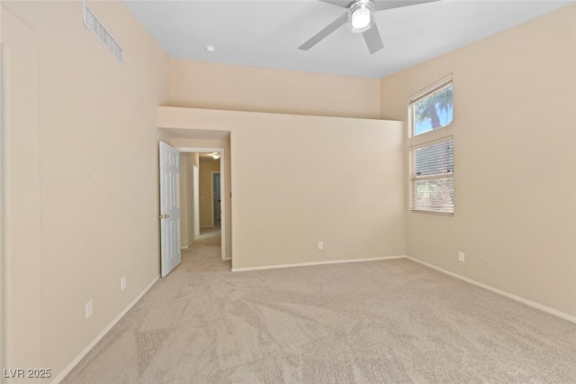 1805 Candle Bright Dr, Henderson, NV 89074 - carpeted spare room with baseboards, a ceiling fan, and visible vents
