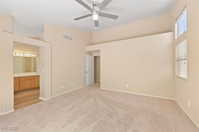 1805 Candle Bright Dr, Henderson, NV 89074 - unfurnished bedroom featuring light carpet, visible vents, and baseboards