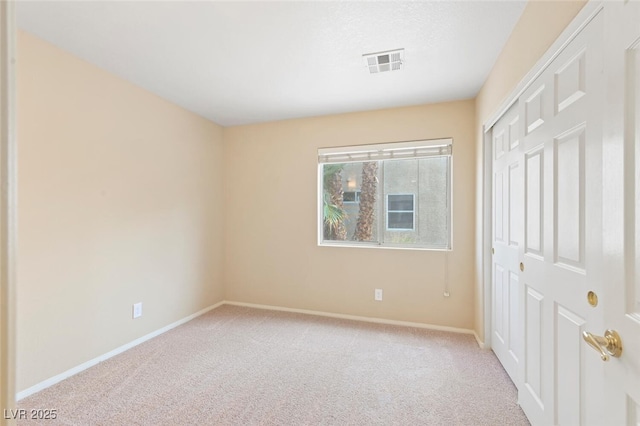 1805 Candle Bright Dr, Henderson, NV 89074 - unfurnished bedroom with baseboards, carpet floors, visible vents, and a closet