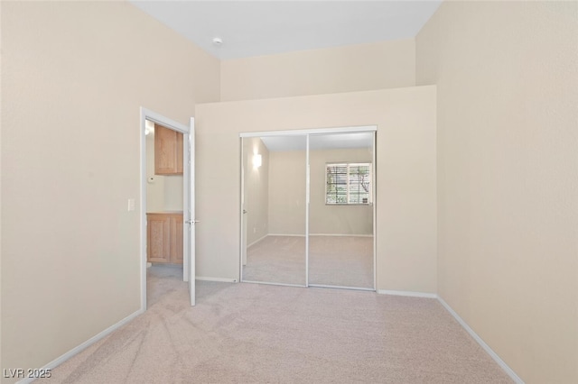 1805 Candle Bright Dr, Henderson, NV 89074 - unfurnished bedroom with baseboards, a closet, and carpet