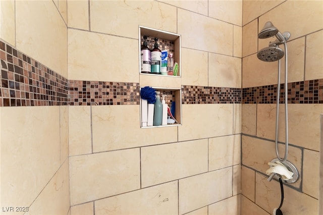 bathroom view of tiled shower