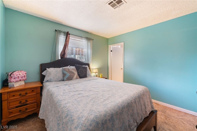 bedroom featuring carpet floors, a textured ceiling, and baseboards