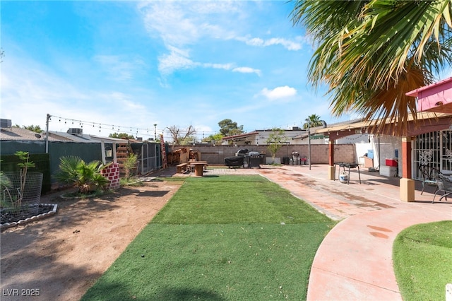 fenced backyard featuring a patio