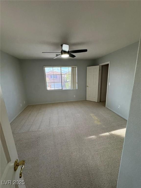 unfurnished bedroom featuring baseboards and carpet floors
