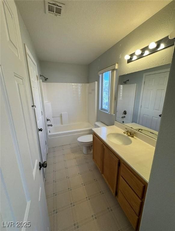 bathroom featuring bathtub / shower combination, tile patterned floors, toilet, vanity, and visible vents