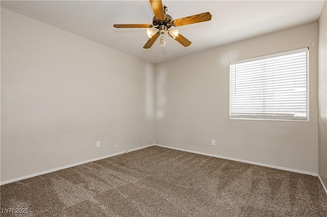 empty room featuring baseboards, ceiling fan, and carpet