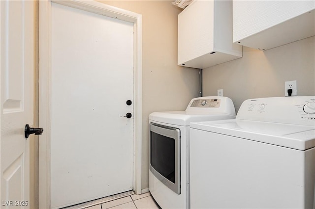 washroom featuring laundry area, light tile patterned floors, and washer and dryer