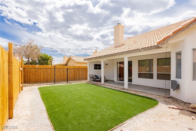 view of yard with a fenced backyard and a patio