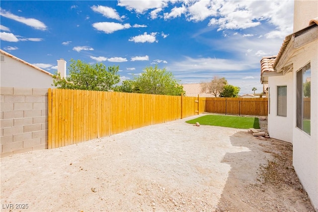 view of yard featuring a fenced backyard and a patio