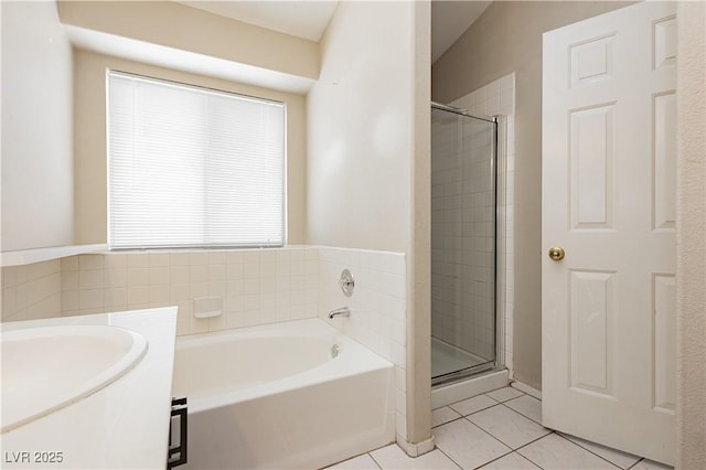 bathroom featuring vanity, tile patterned flooring, a stall shower, and a bath