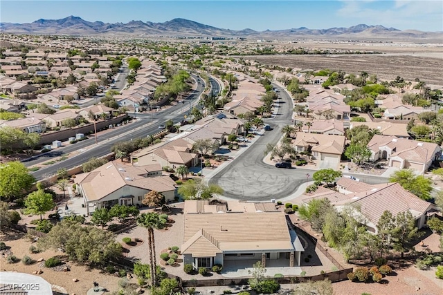birds eye view of property with a residential view and a mountain view