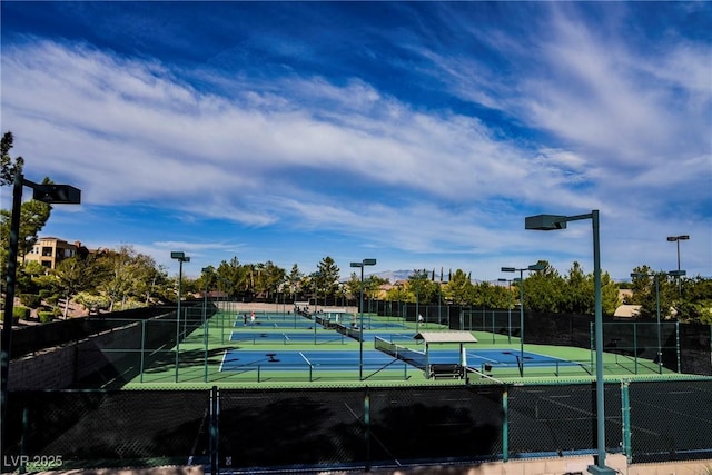 view of sport court with fence