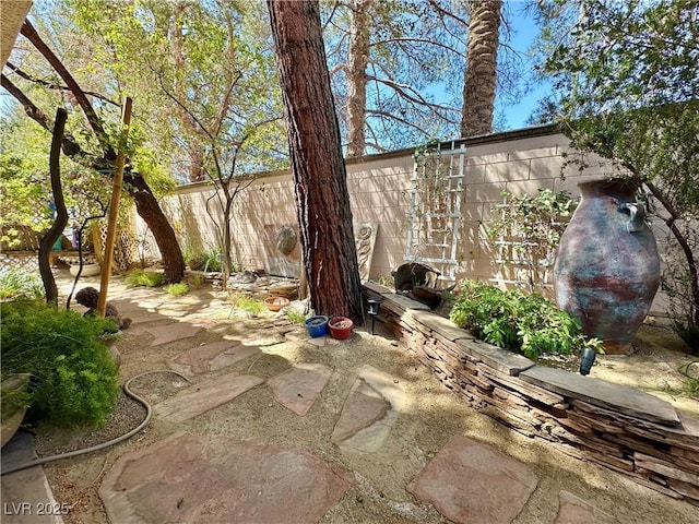 view of patio / terrace featuring fence