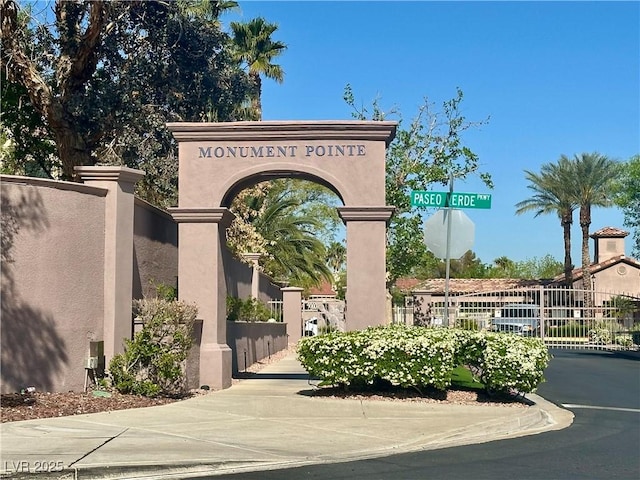community sign featuring fence