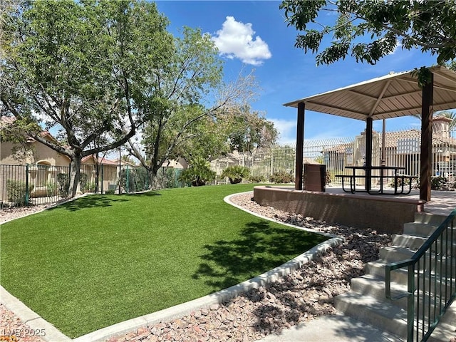 view of yard featuring a gazebo and fence