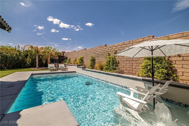 view of swimming pool with a fenced backyard and a fenced in pool