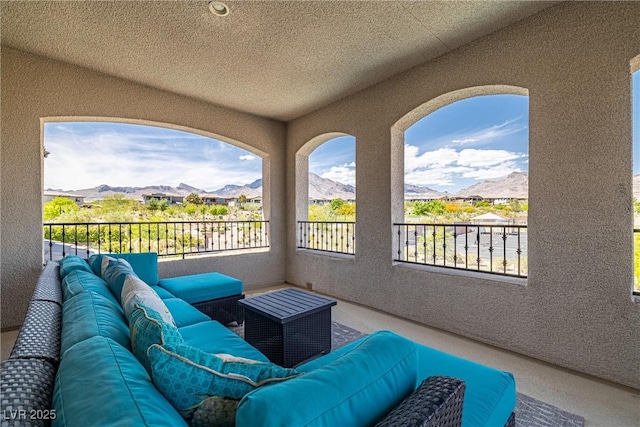 balcony featuring outdoor lounge area and a mountain view