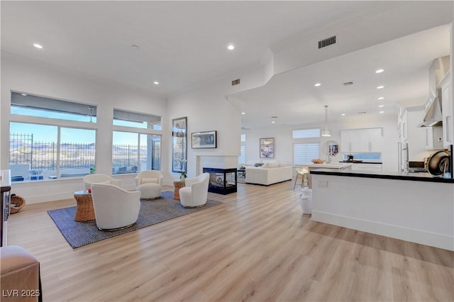 3091 Via Del Corso, Henderson, NV 89052 - living area with light wood-style floors, recessed lighting, and visible vents