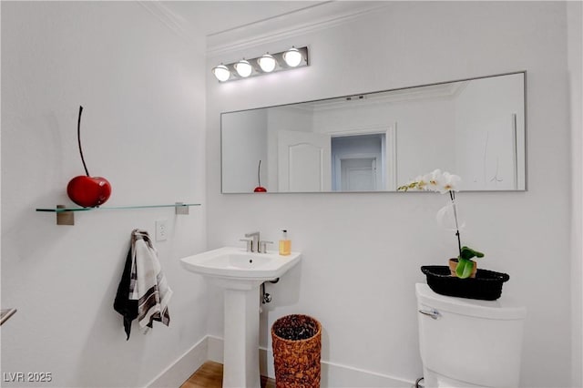 3091 Via Del Corso, Henderson, NV 89052 - half bathroom with baseboards, ornamental molding, and toilet