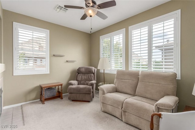 sitting room featuring carpet, visible vents, a ceiling fan, and baseboards
