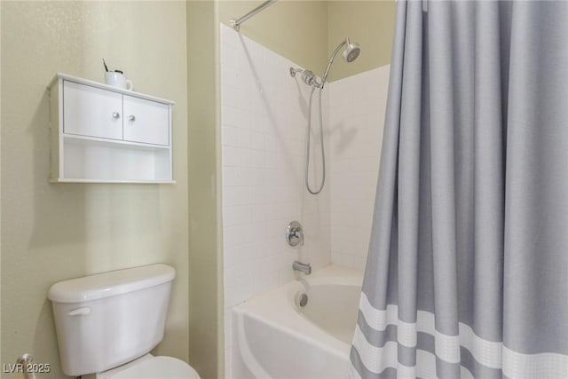 bathroom featuring shower / tub combo with curtain and toilet